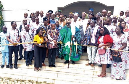 Naa Mahamadu Bawa (middle), the Paramount Chief of the Nanton Traditional Area, being assisted by Samuel Kow Donkoh (3rd from left), the President of the PSGH, and Shani Alhassan Shaibu (2nd from left), the Northern Regional Minister, to cut the ribbon to officially open the event.      